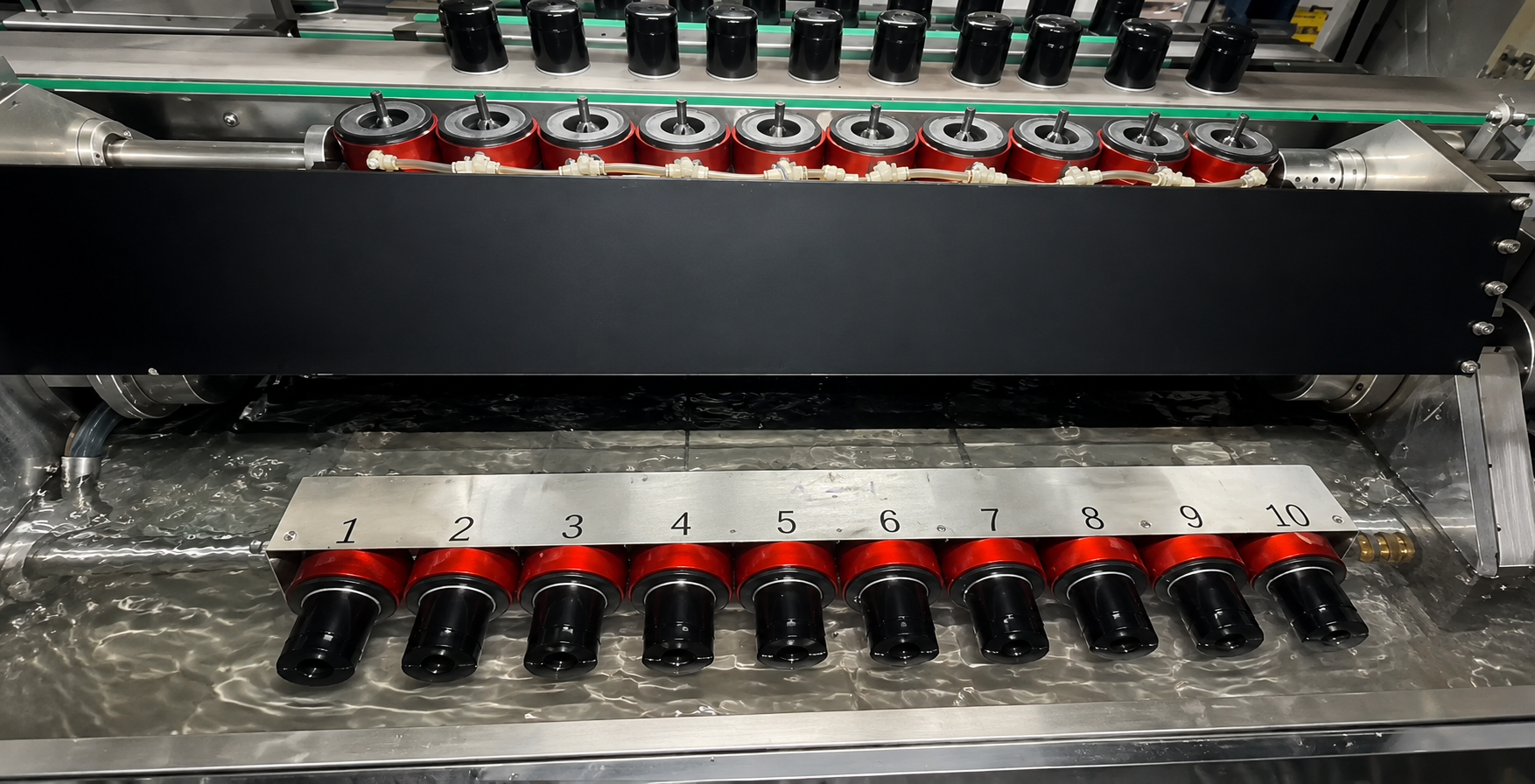 Multiple oil filter components undergoing production quality testing
